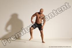 Underwear Gymnastic poses Man Black Muscular Bald Dancing Dynamic poses Academic